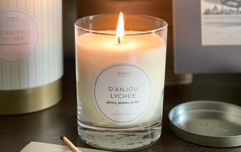 Lighted scented candle on a table